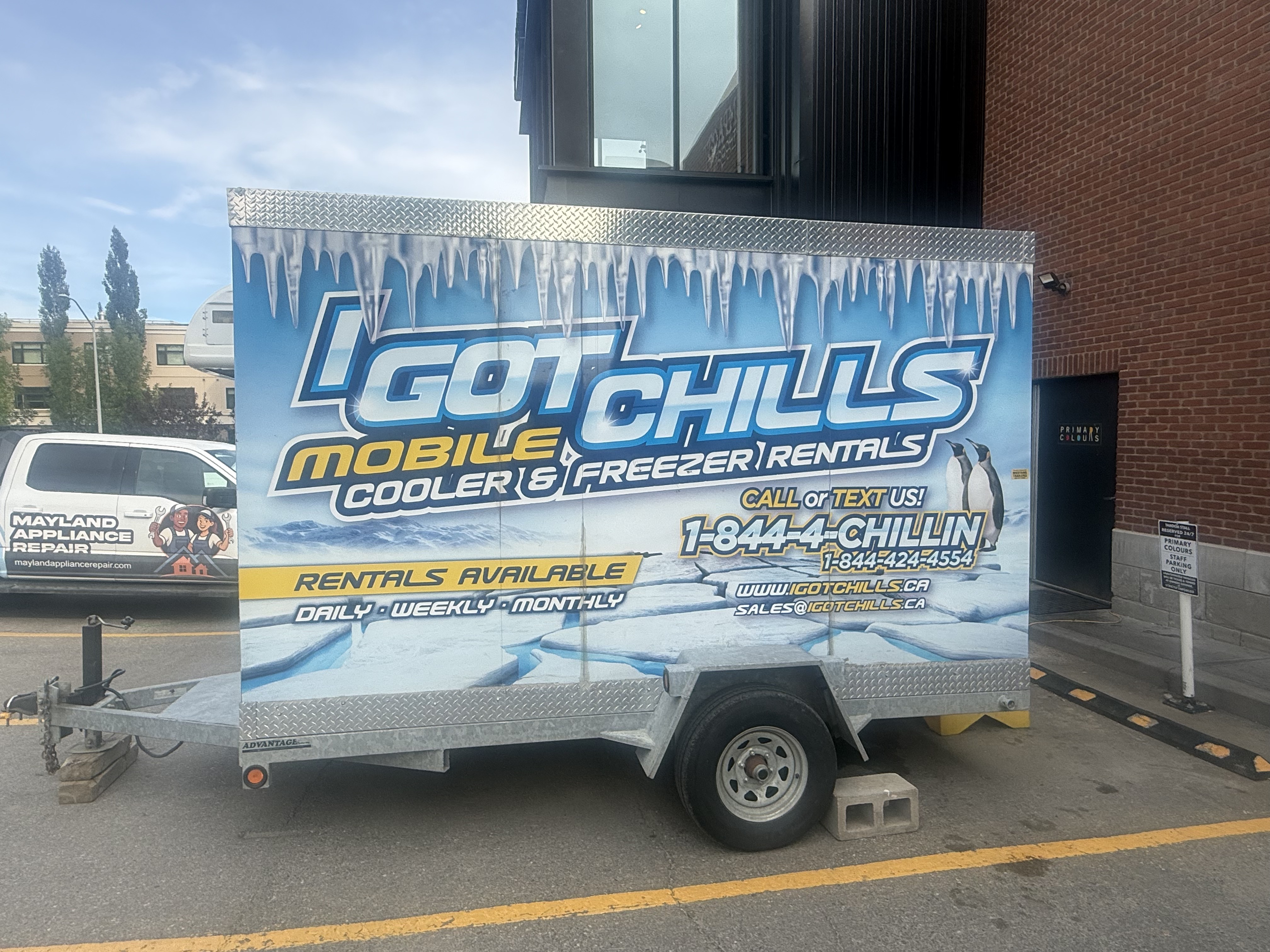 I Got Chills mobile cooler and freezer trailer parked beside a Calgary business