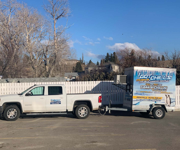 Pickup truck hitched to an I Got Chills cooler trailer ready for delivery